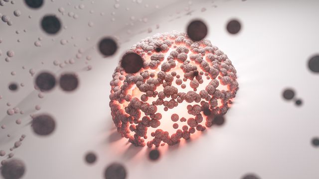 A magnified cell, representing inherited susceptibility to a health condition